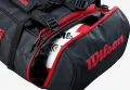 Kieszeń torby Wilson Duffle Bag z czerwonym suwakiem i piłką w środku